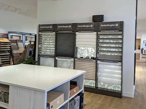 Store interior showcasing several different types of window coverings