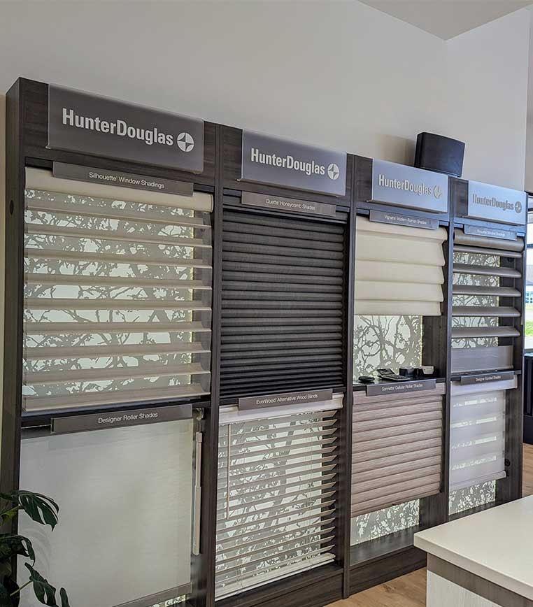 Store interior showcasing several different types of window coverings